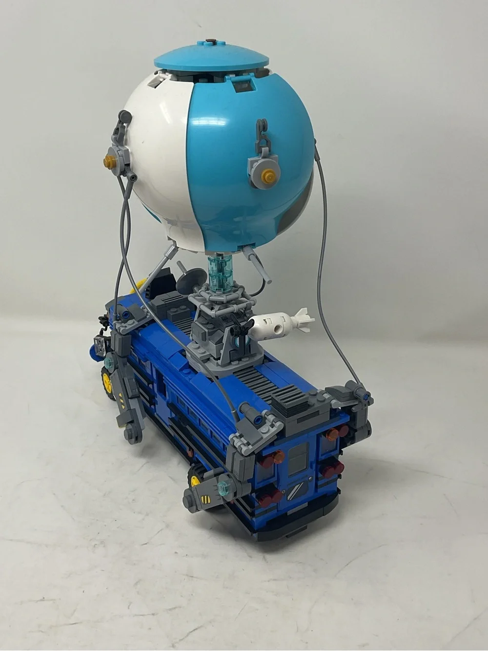 LEGO Blue and White Fortnite Battle Bus with Yellow Accents